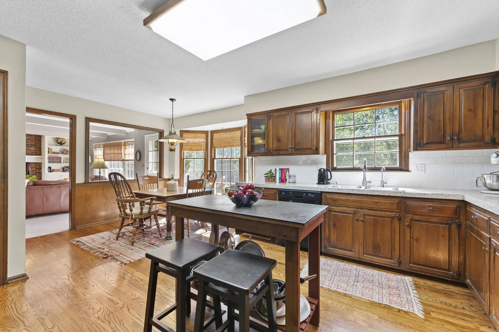 Kitchen with hardwood floors, open to the breakfast nook and family room