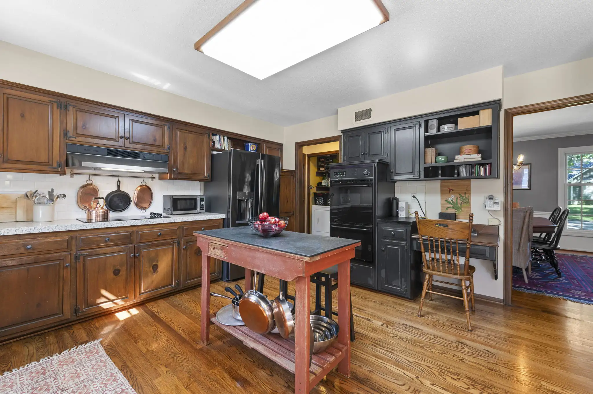 Kitchen with double wall ovens and built-in desk