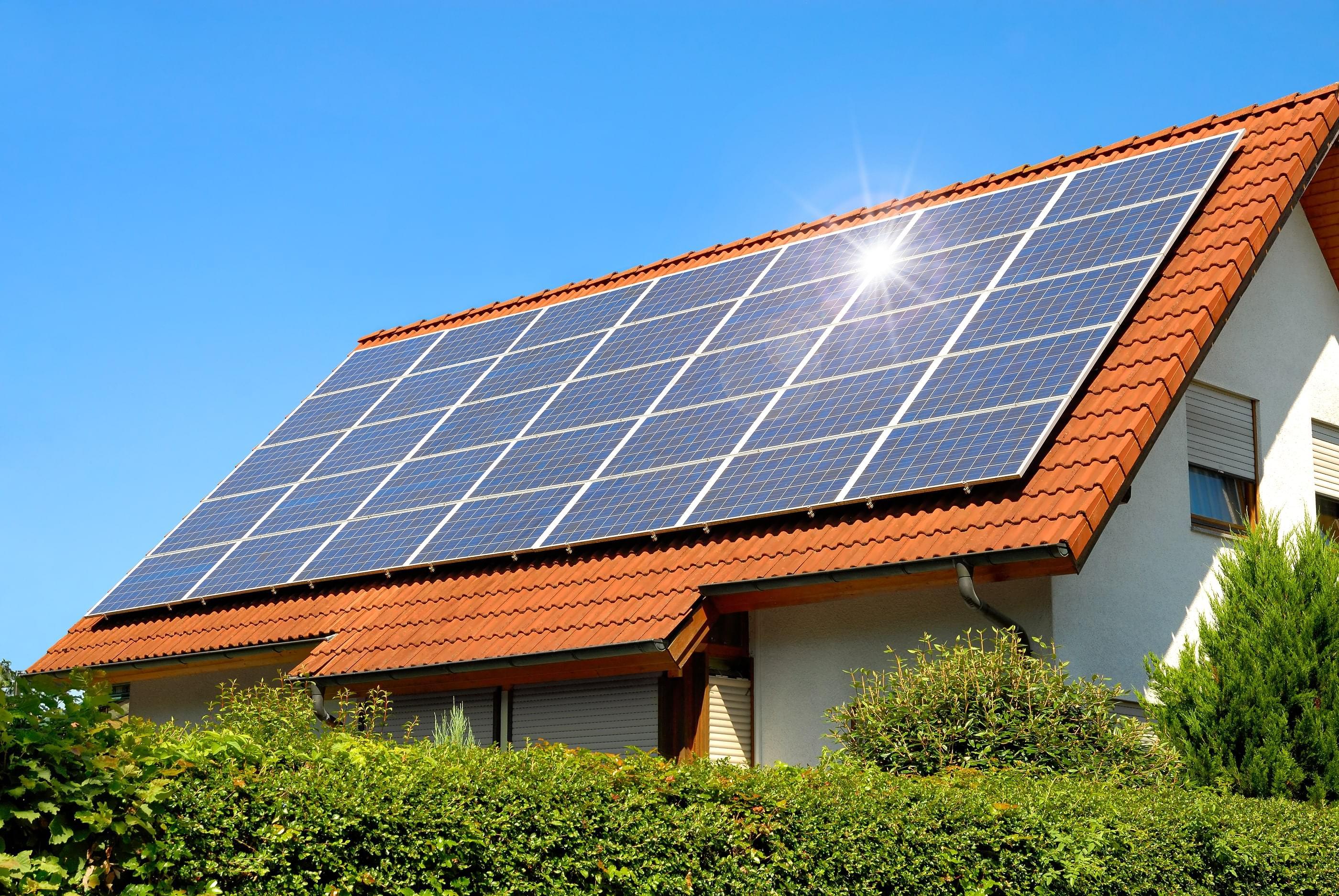 A terracotta roof with solar panels