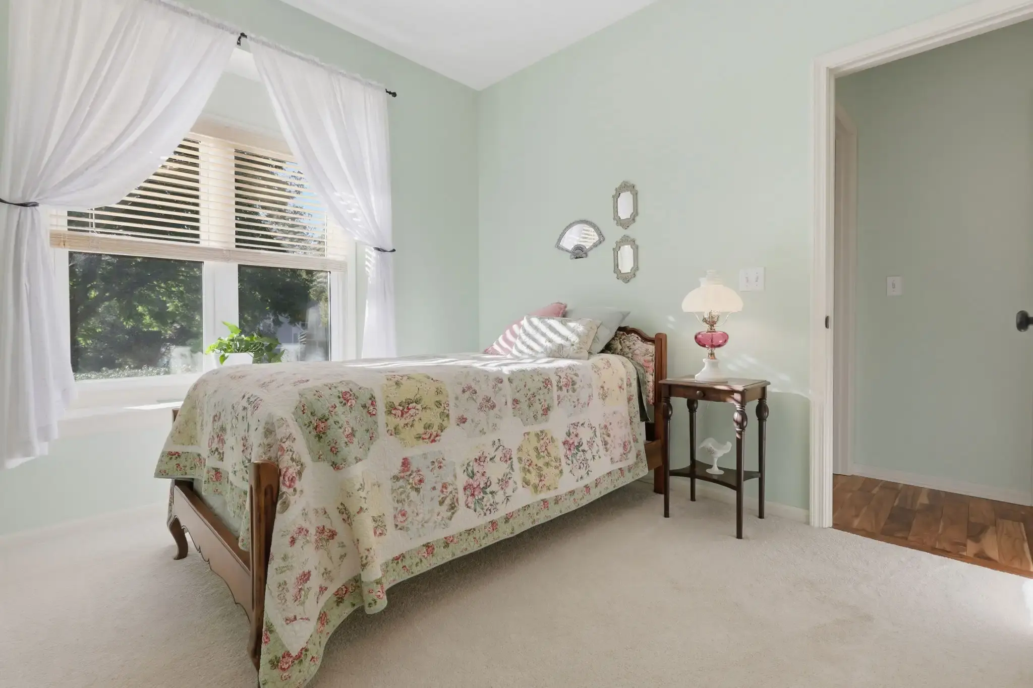 Main-level bedroom with large window