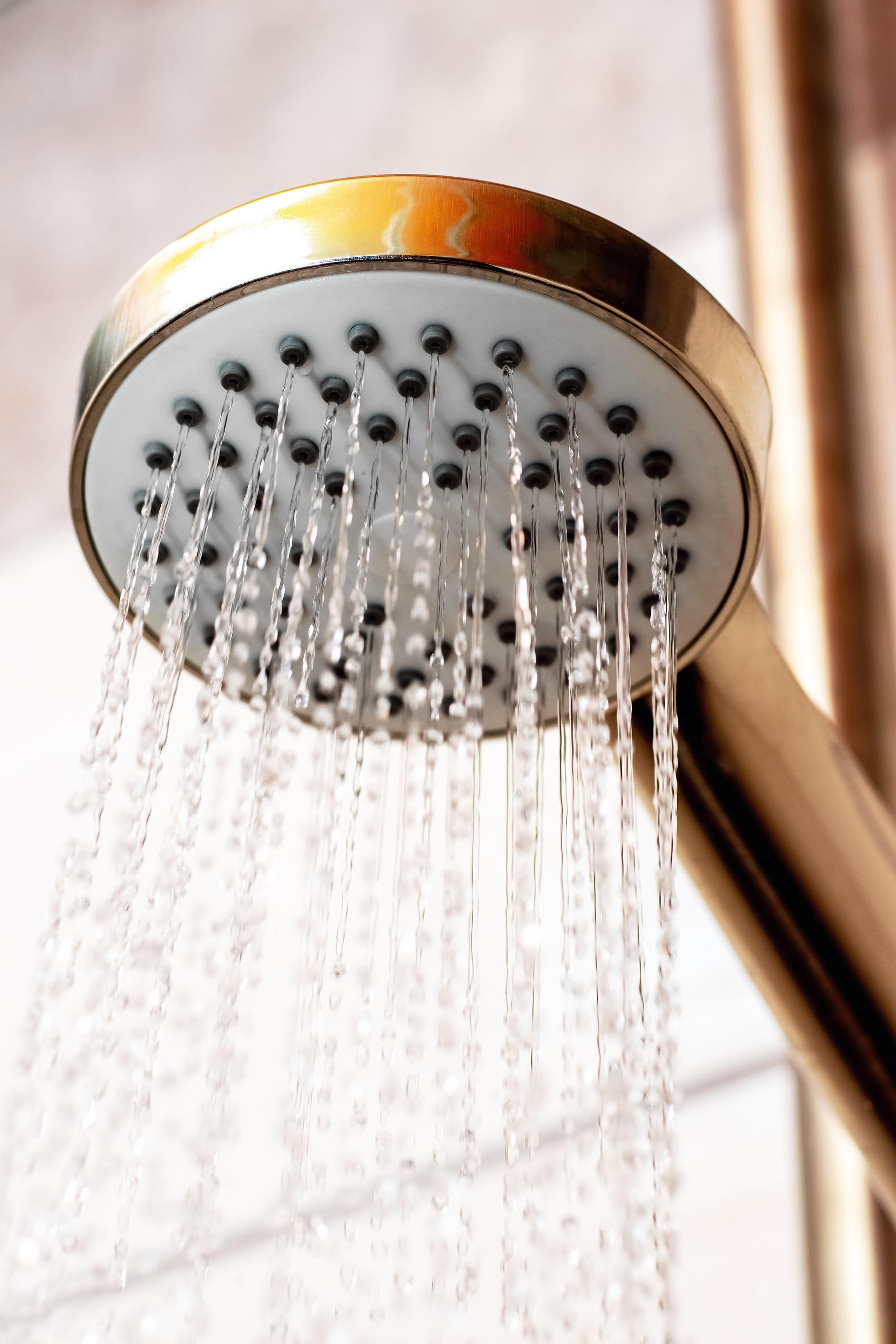 A closeup on a copper-colored showerhead