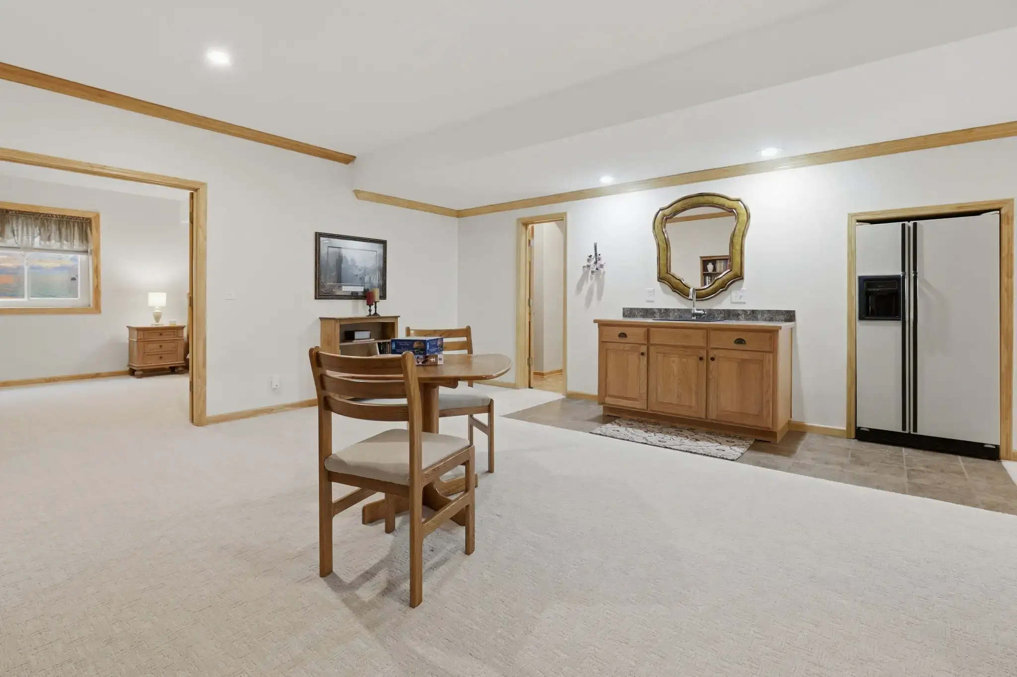 Lower-level wet bar and game table open to the family room