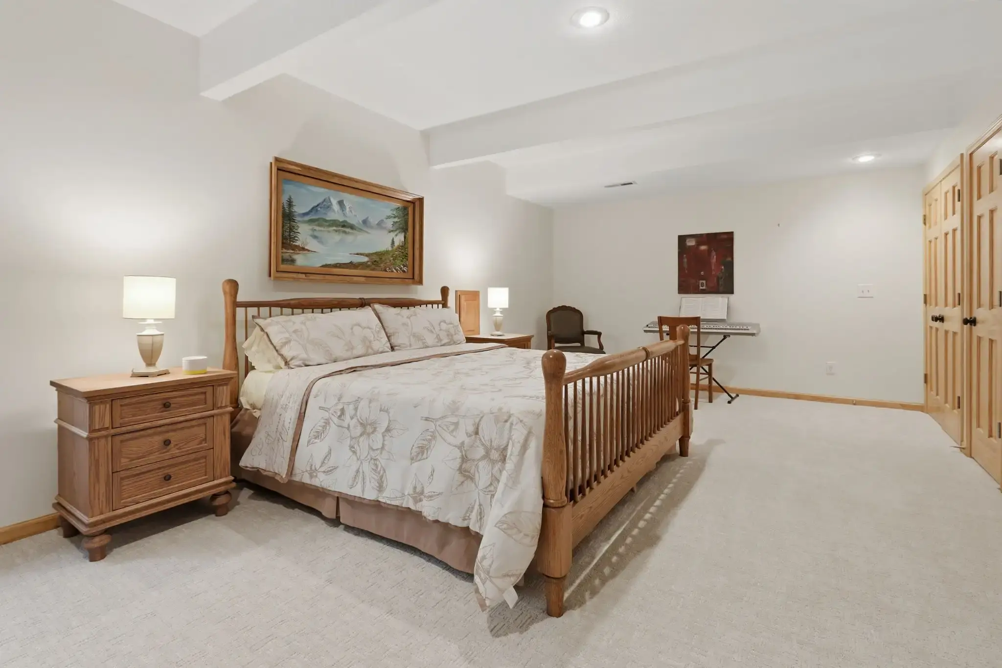 Lower-level bedroom with double closet and recessed lighting