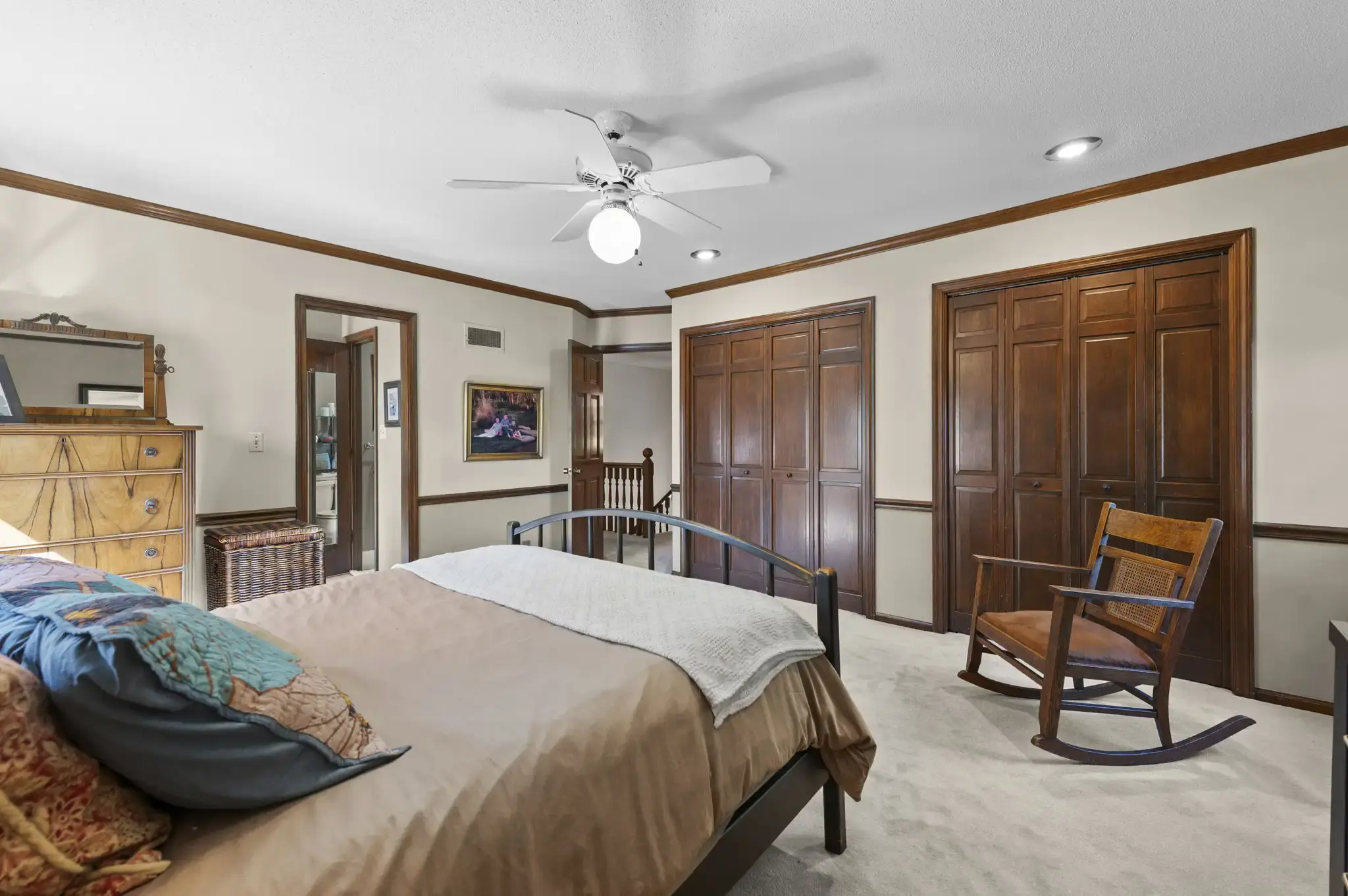 Primary bedroom with two double-door closets