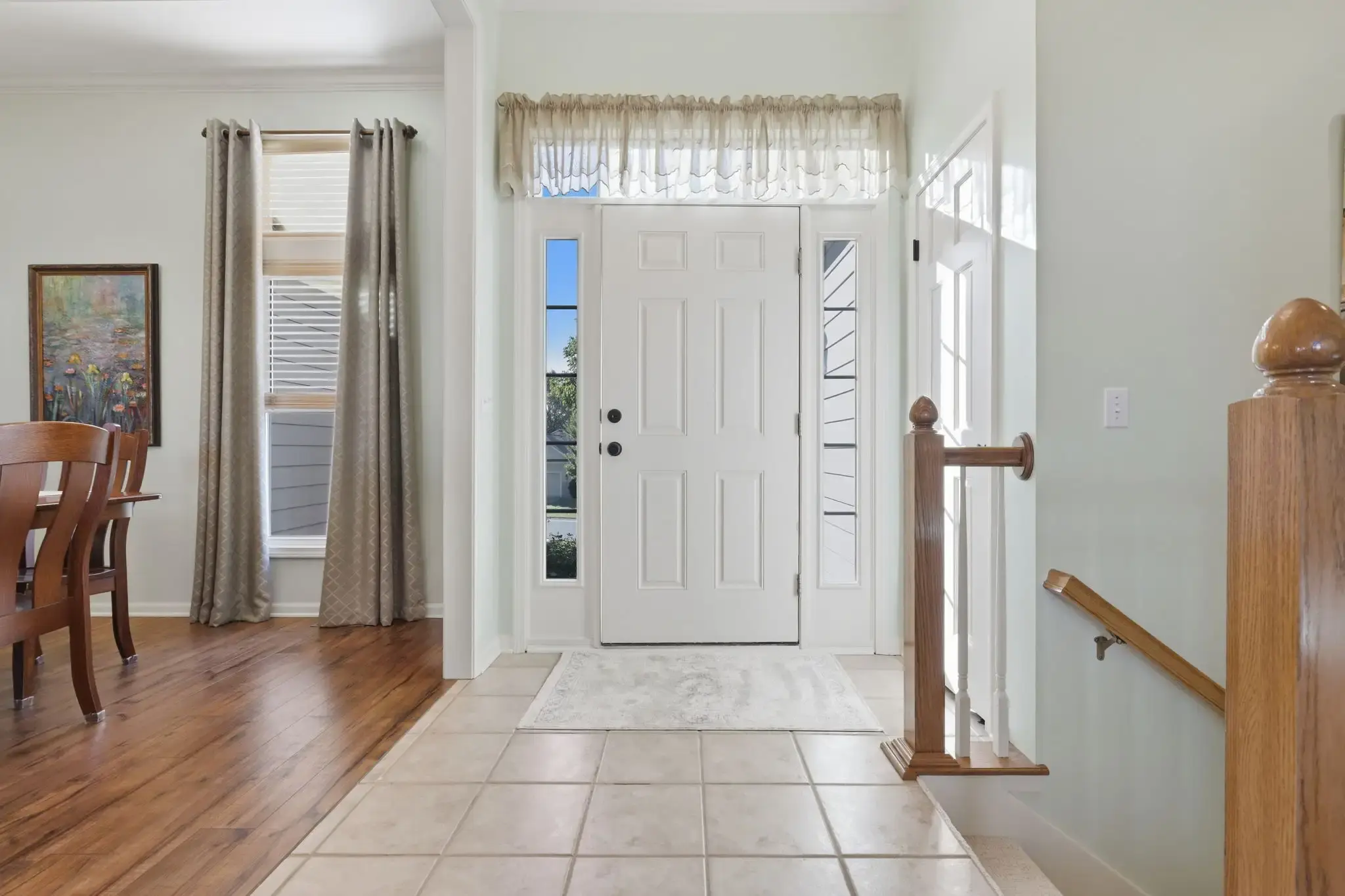 Front entry with tile floor, sidelights and stairs to the lower level