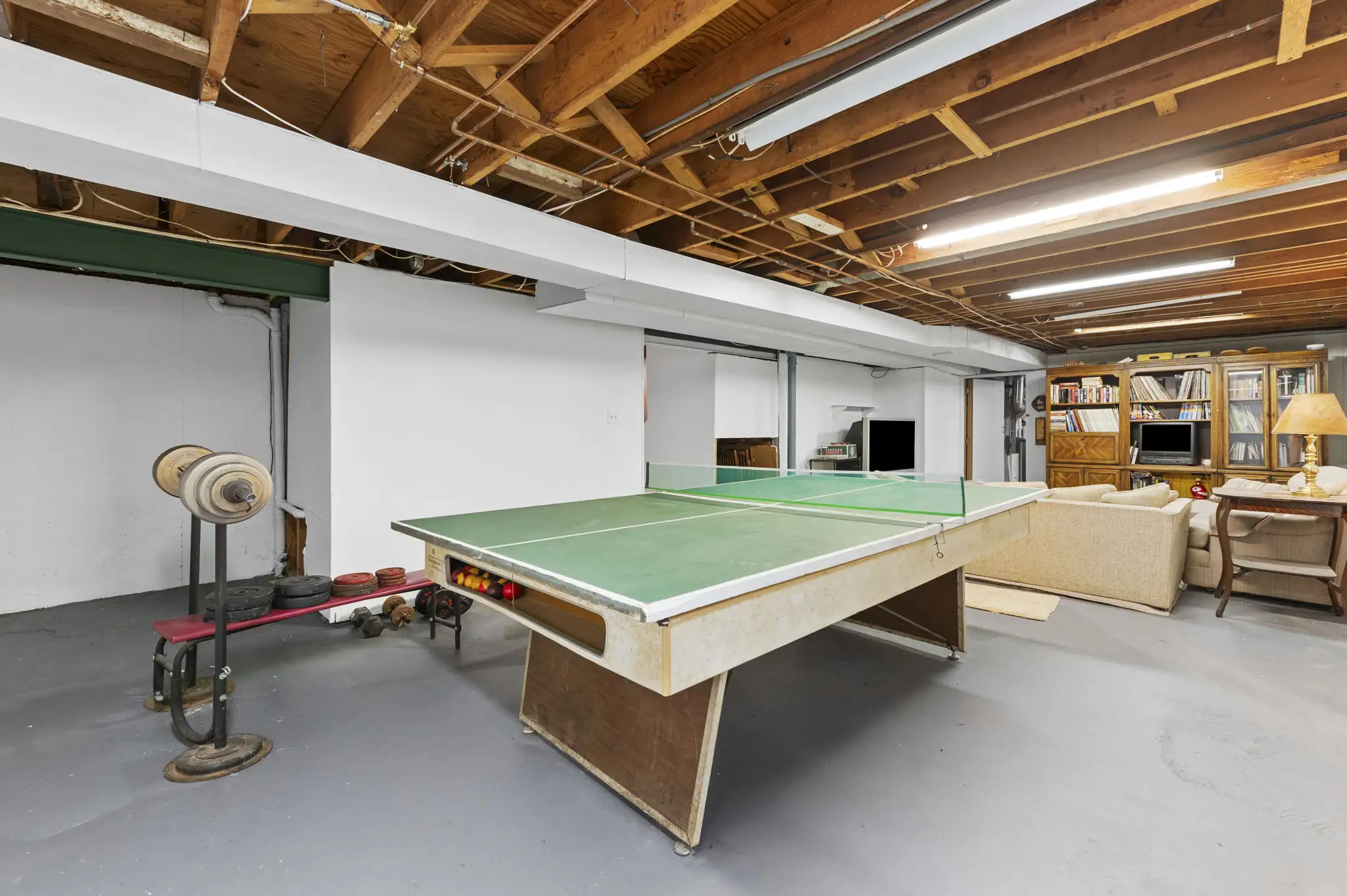 Unfinished basement with open layout and future finishing potential