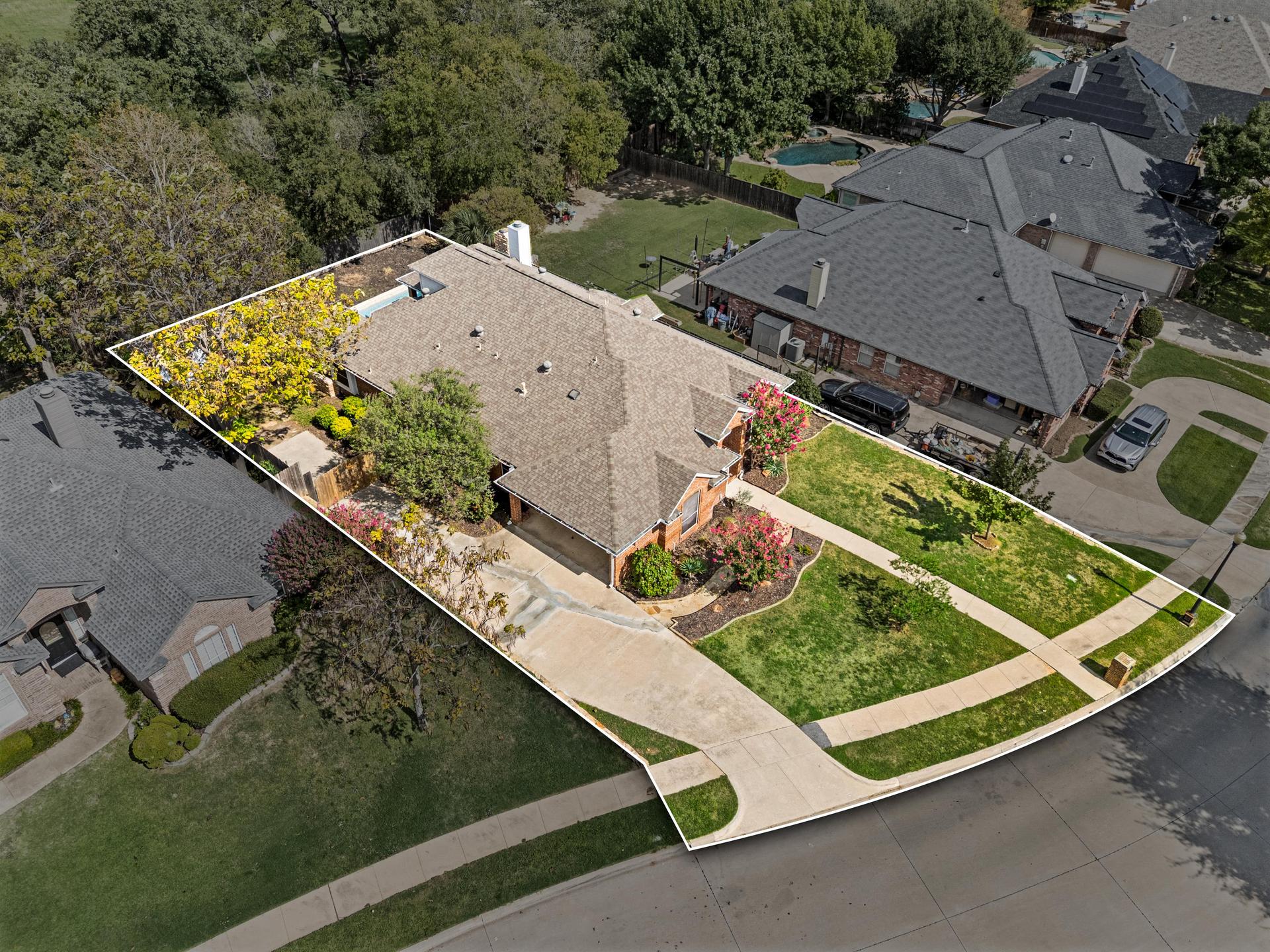 Additional exterior view of the brick home at 7613 Woodhaven Drive