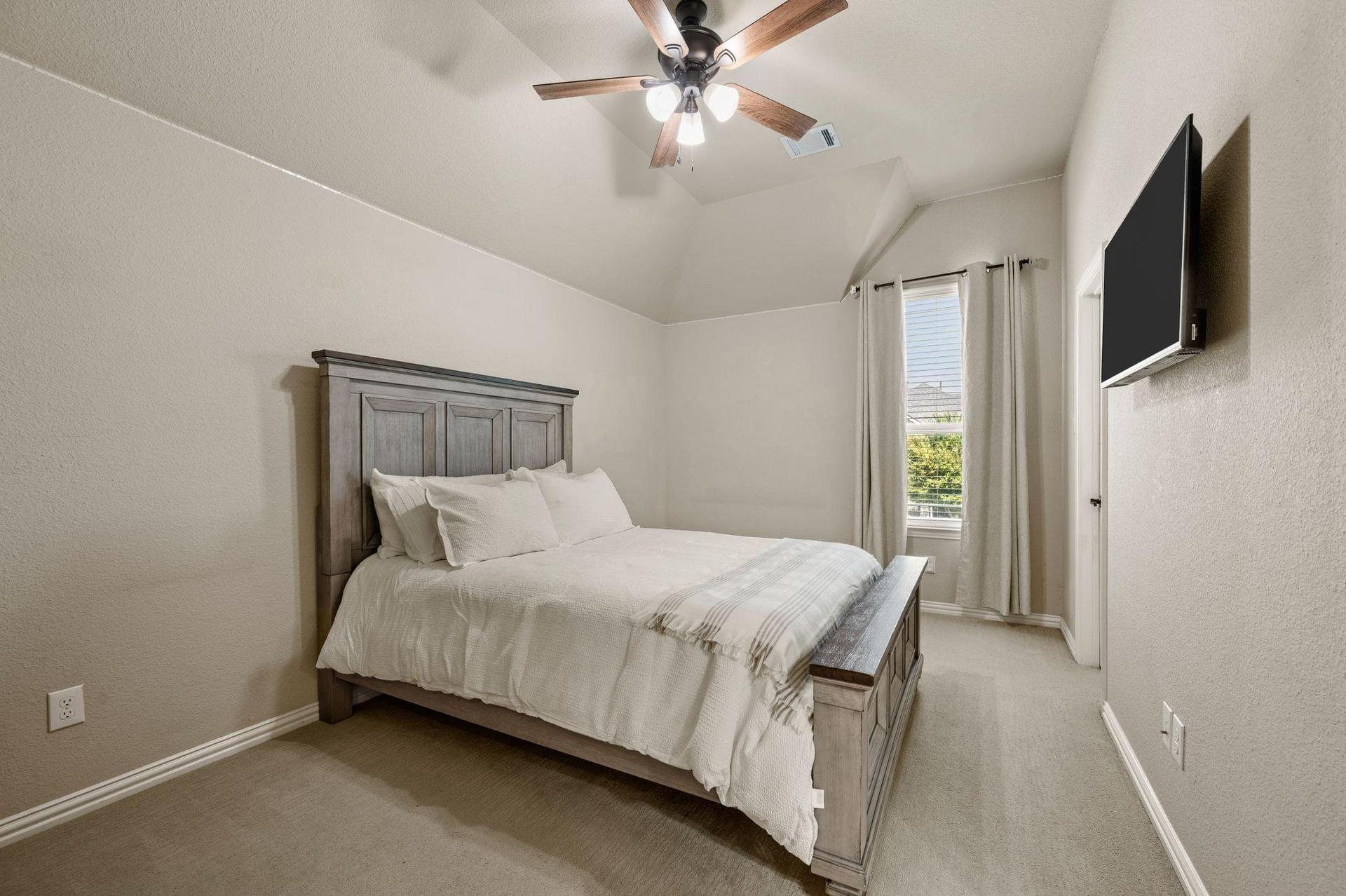 Spacious secondary bedroom at 4201 Rainwater Creek Way in Celina, Texas