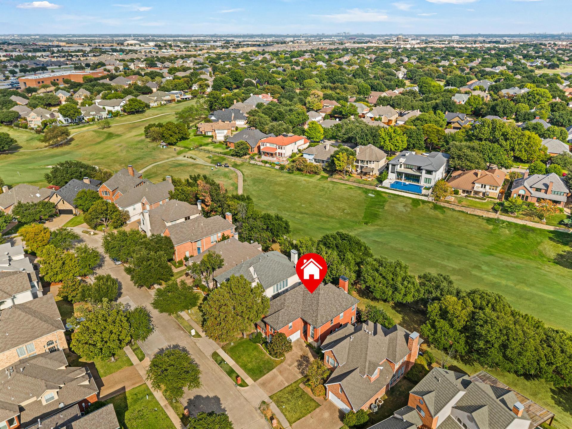 Aerial view of 7626 Lakecrest Circle with Hackberry Creek Golf Course and surrounding homes