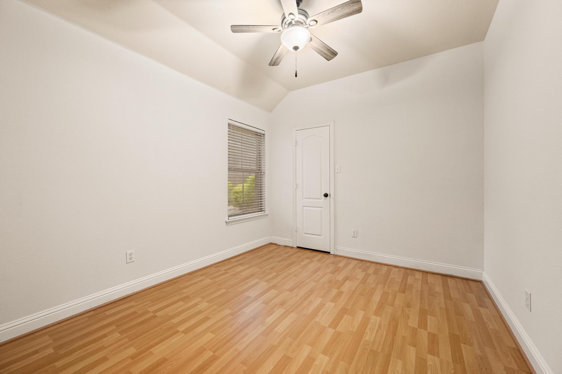 Another bedroom downstairs with a walk-in closet.
