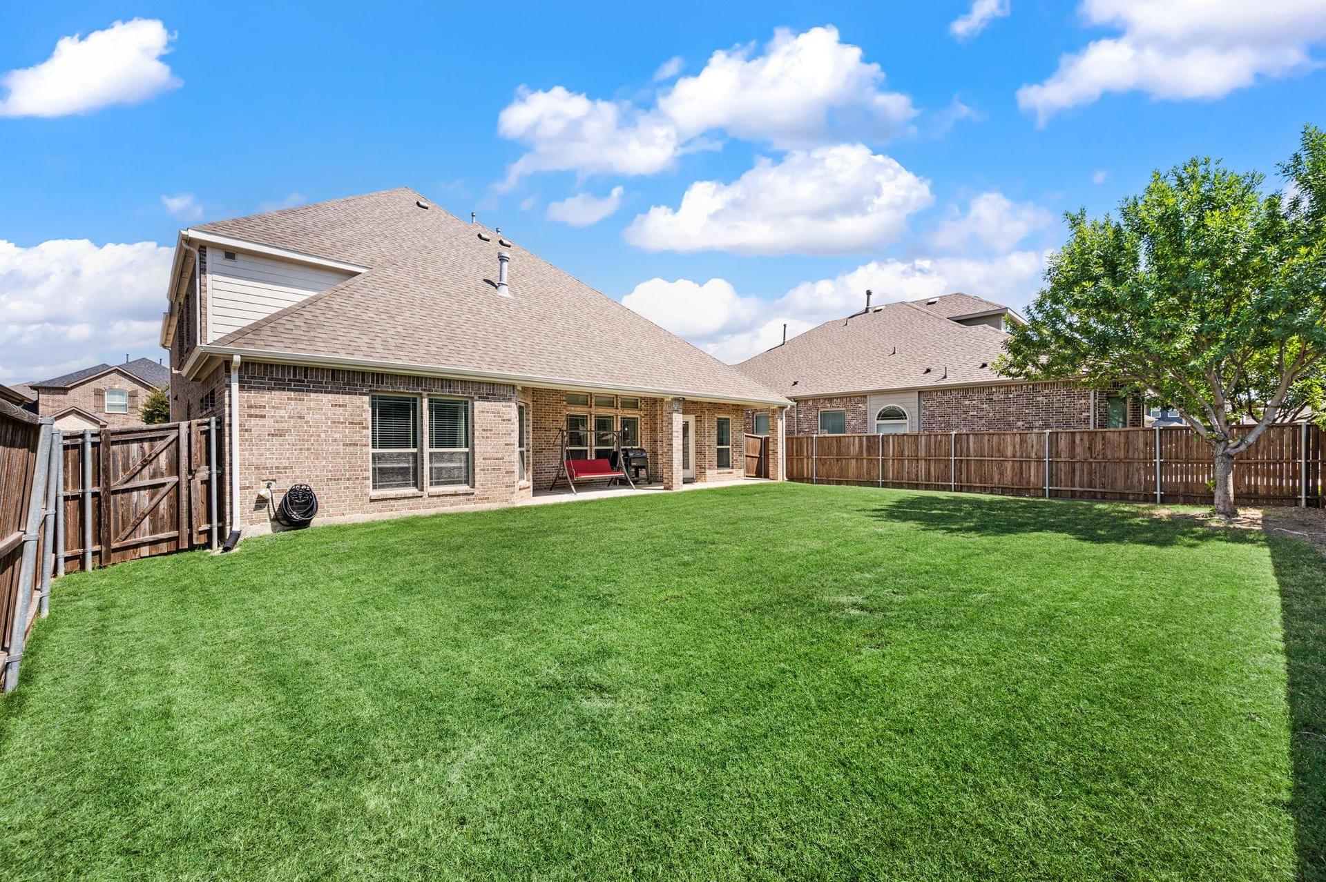 Covered patio and backyard at 4201 Rainwater Creek Way
