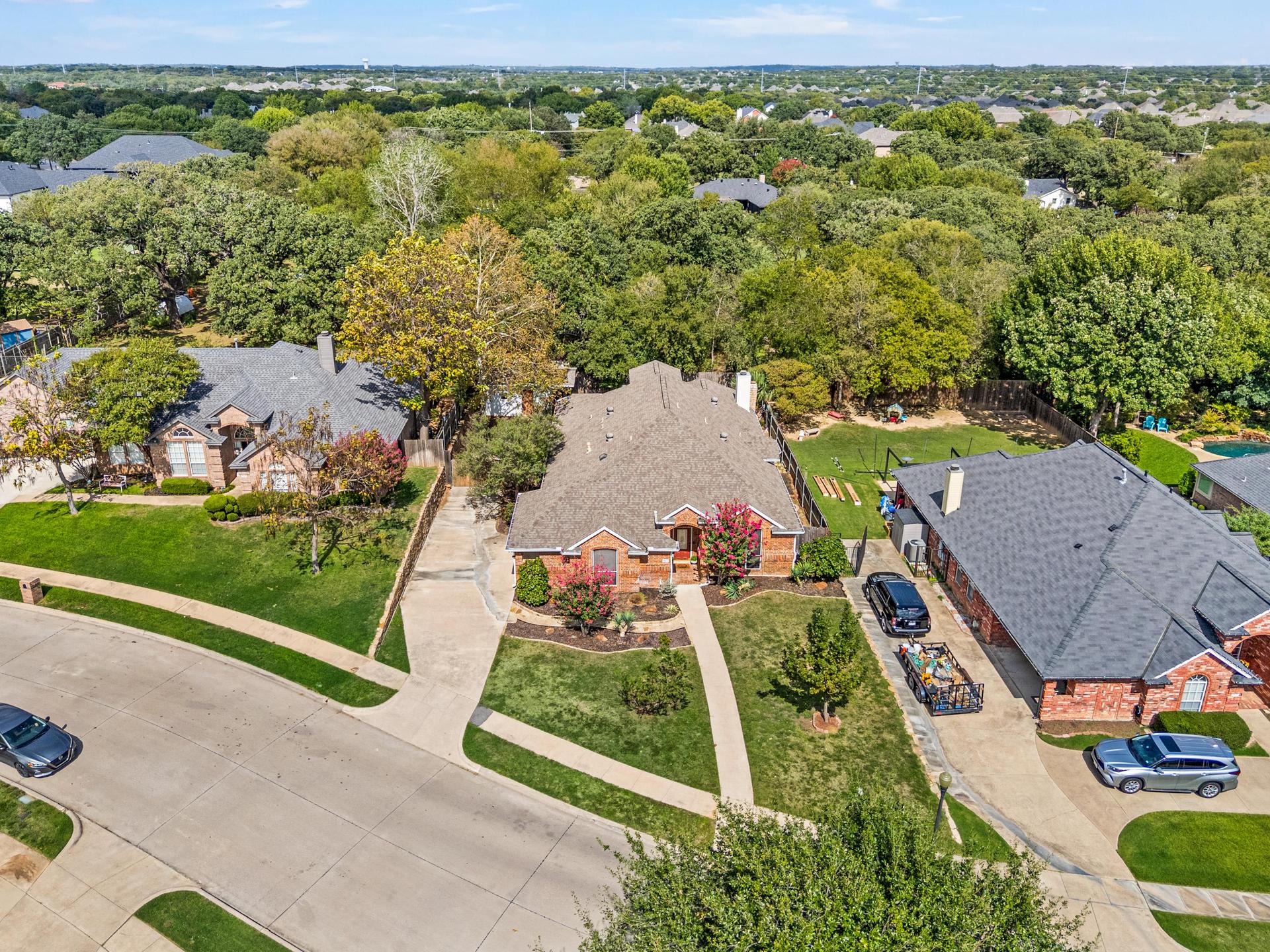 Front exterior view of the brick home at 7613 Woodhaven Drive