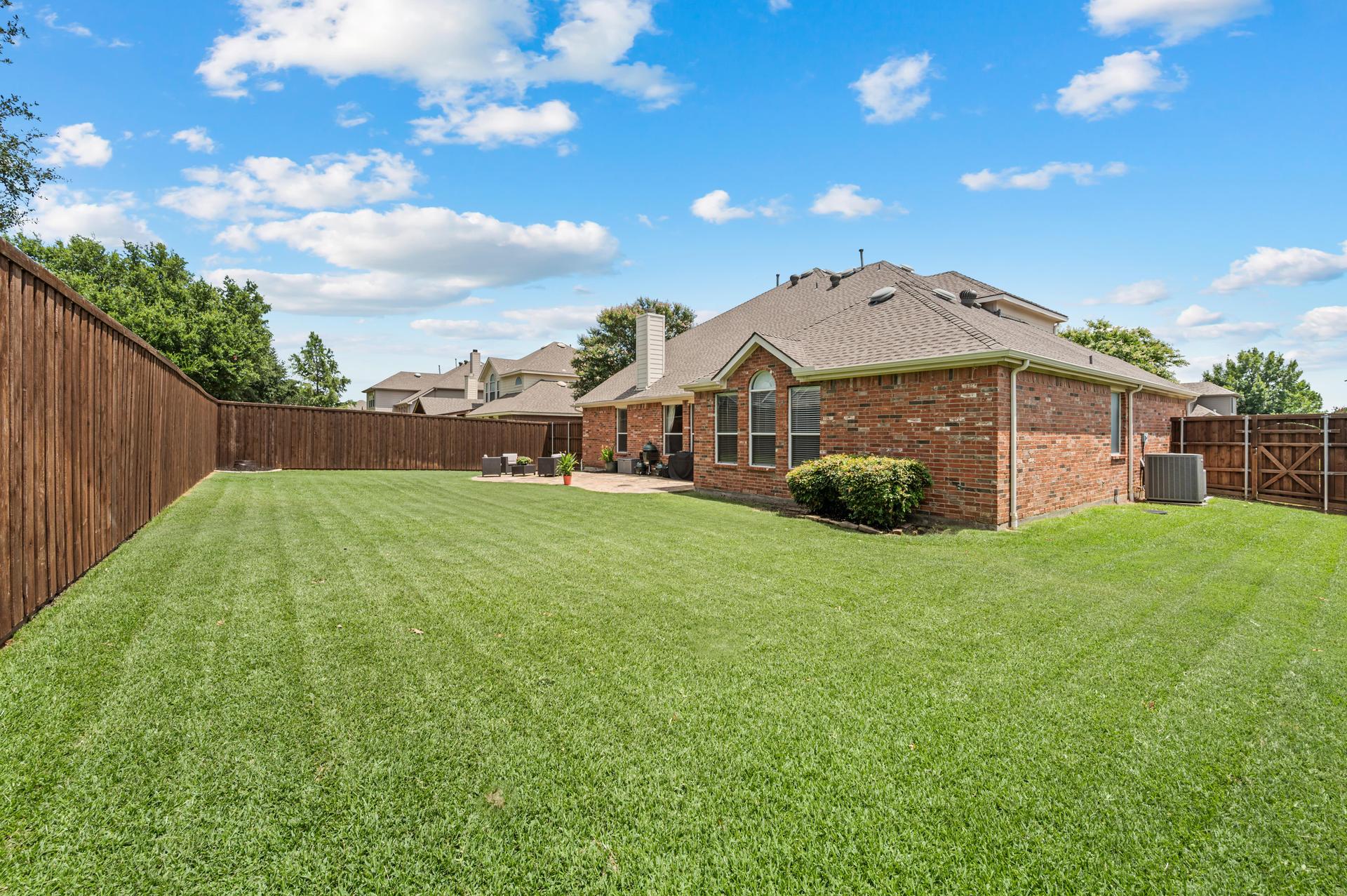 Large backyard at 1404 Big Falls Drive