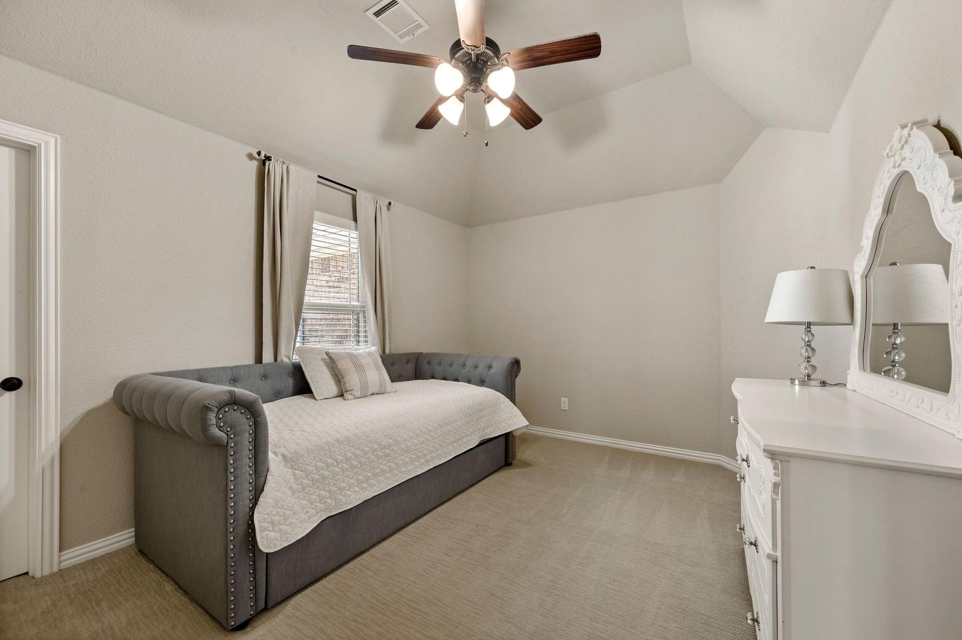 Spacious secondary bedroom at 4201 Rainwater Creek Way in Celina, Texas