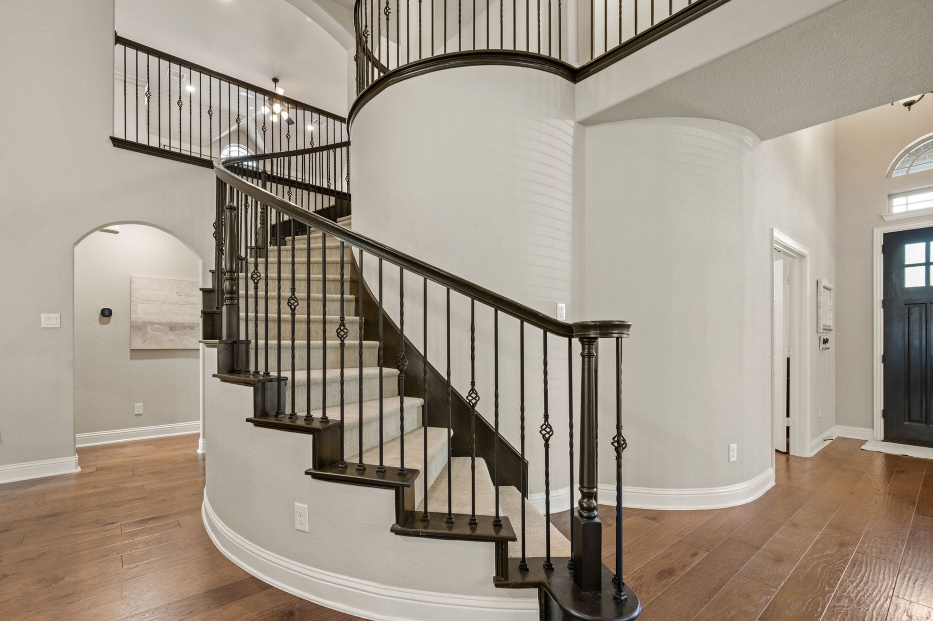 Grand staircase at 4201 Rainwater Creek Way in Celina, Texas