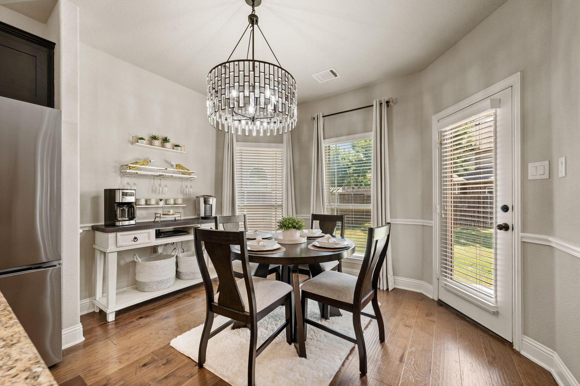 Dining area designed for family meals and time together at 4201 Rainwater Creek Way in Celina, Texas