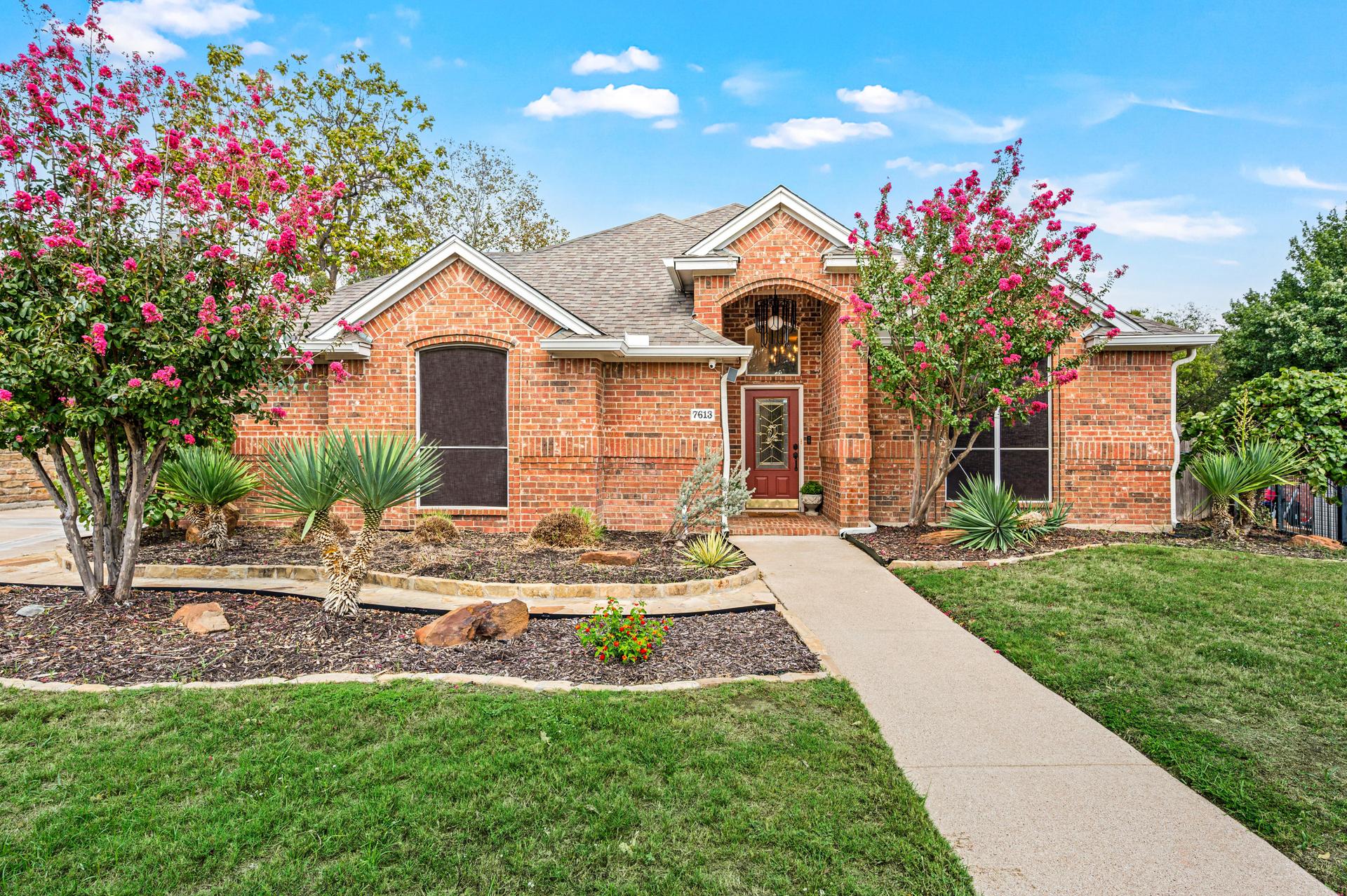 Aerial view of the front property at 7613 Woodhaven Drive
