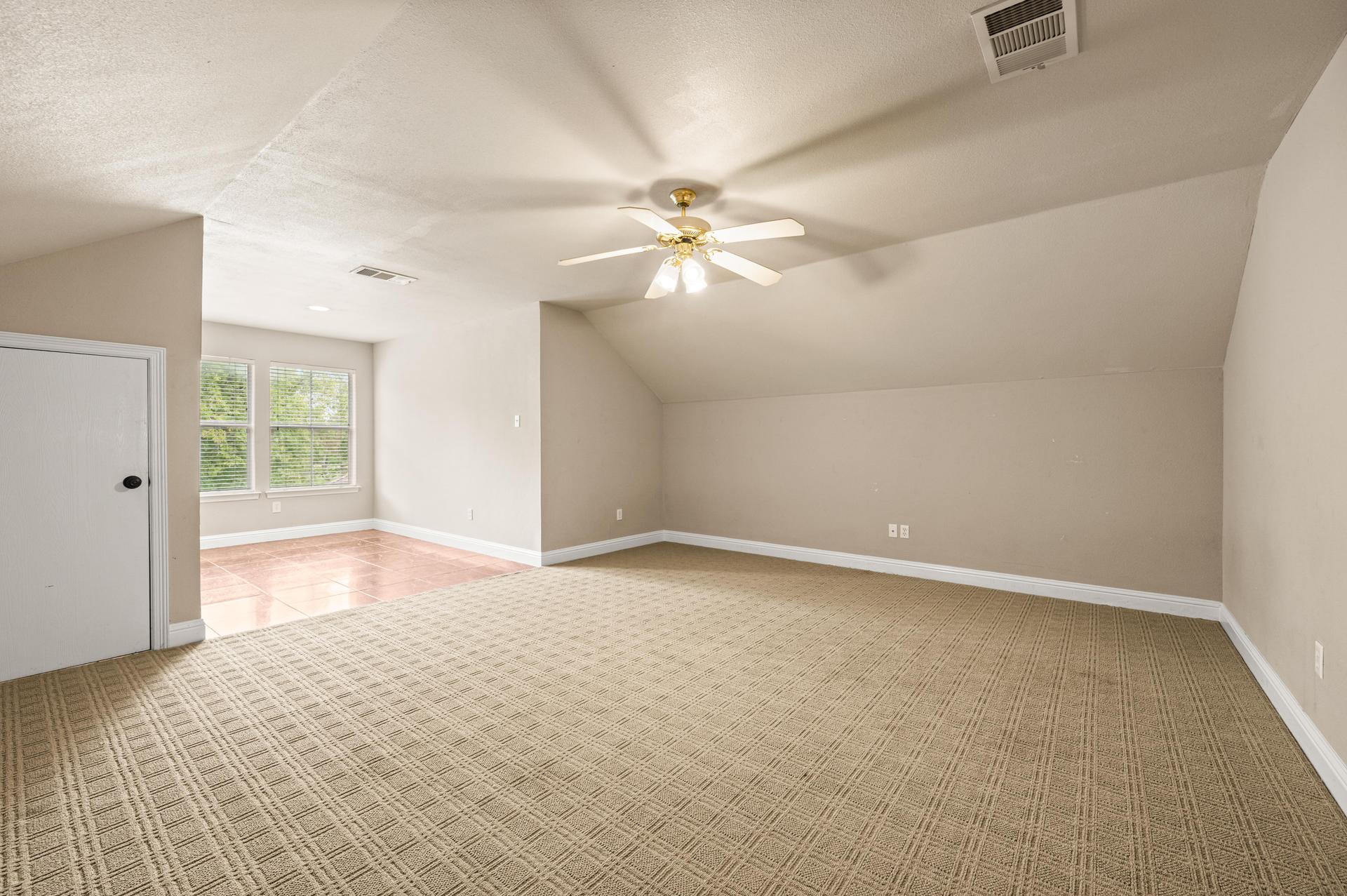 Upstairs flex space that could be used as an additional bedroom or game room