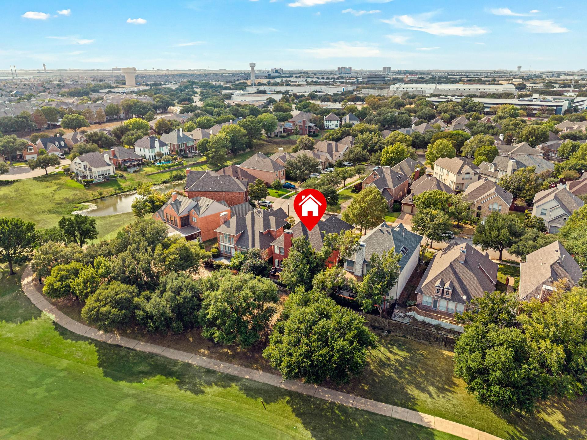 Aerial view of 7626 Lakecrest Circle overlooking Hackberry Creek Golf Course
