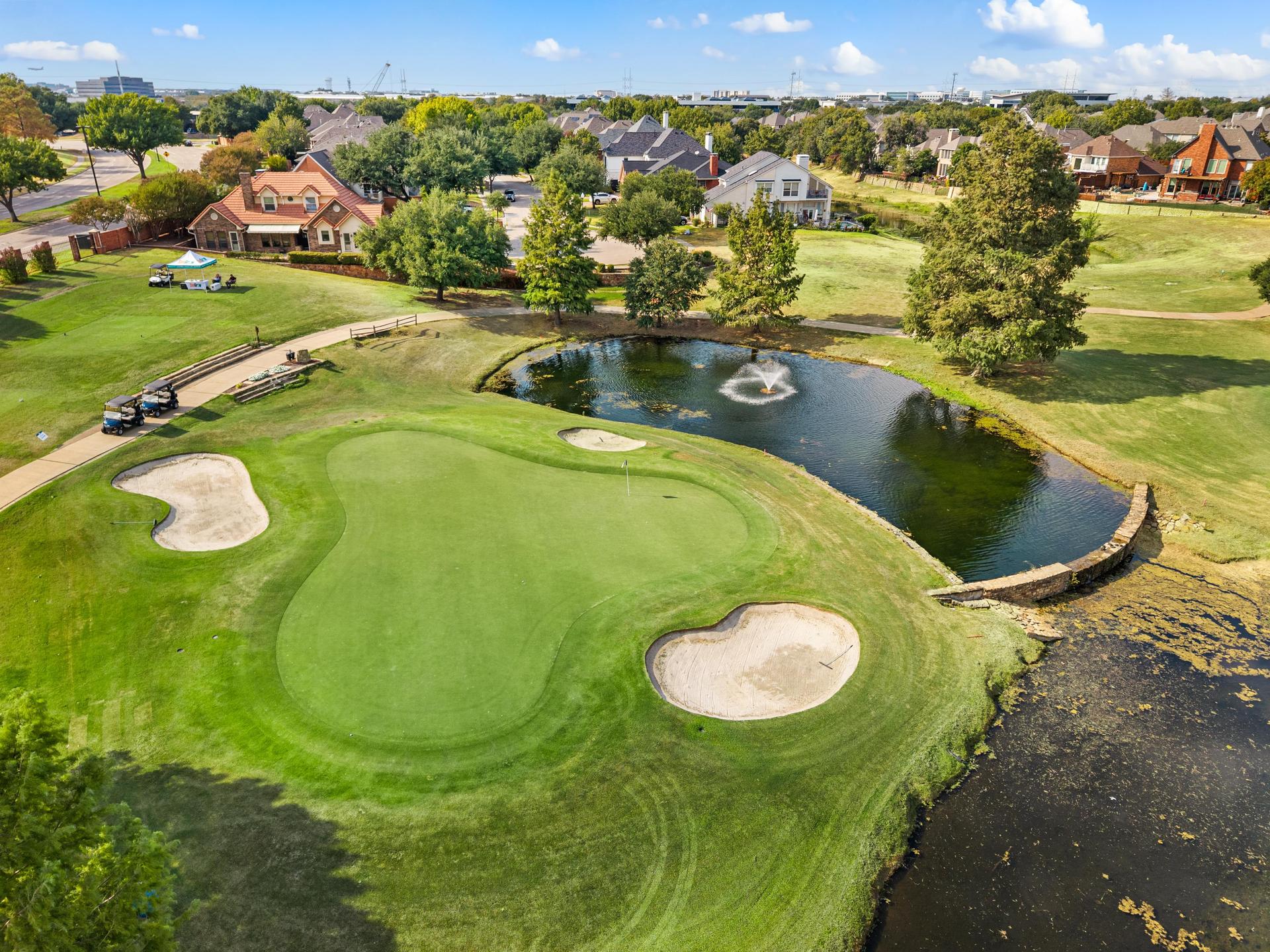 Hackberry Creek Golf Course with fairways, ponds, and surrounding homes near 7626 Lakecrest Circle