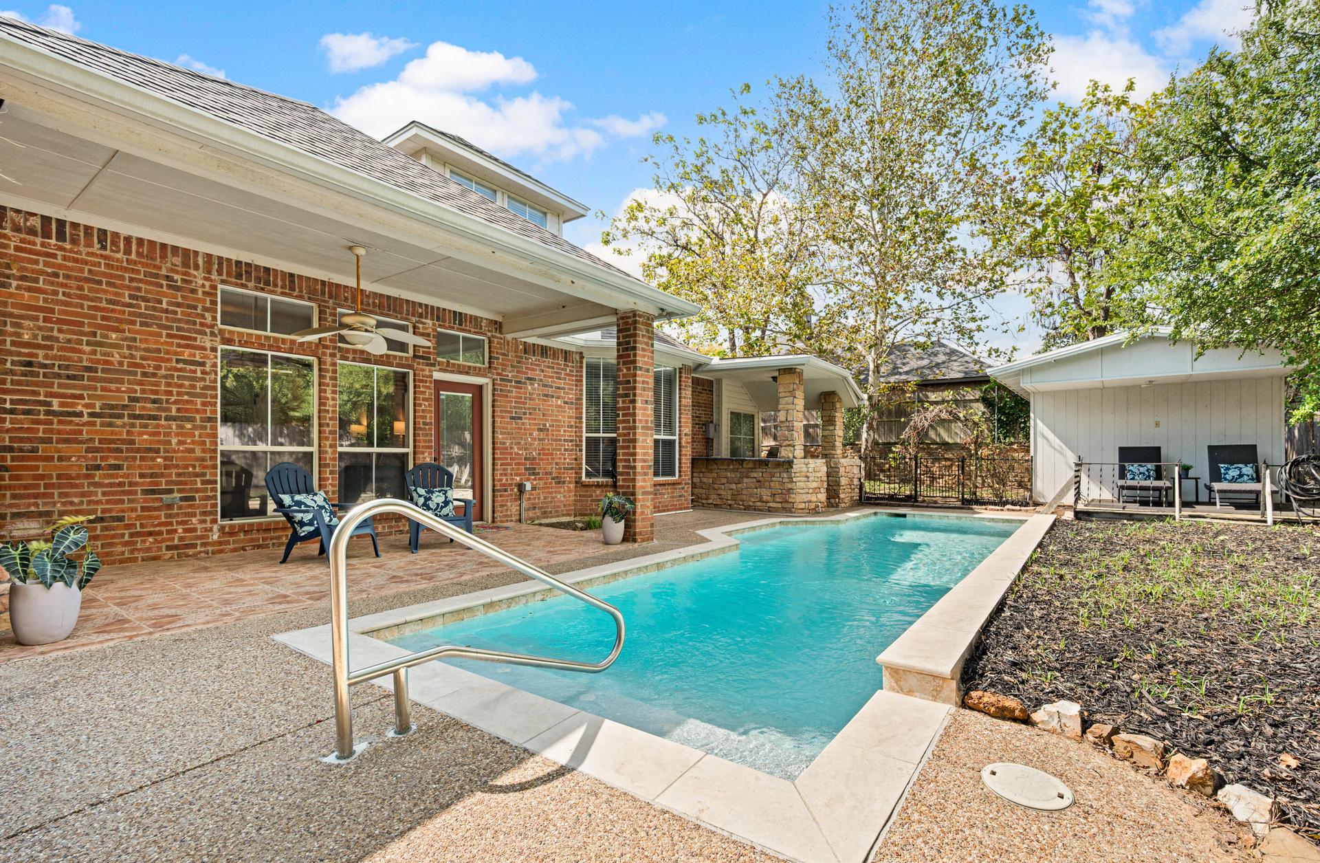 Backyard outdoor living area at 7613 Woodhaven Drive