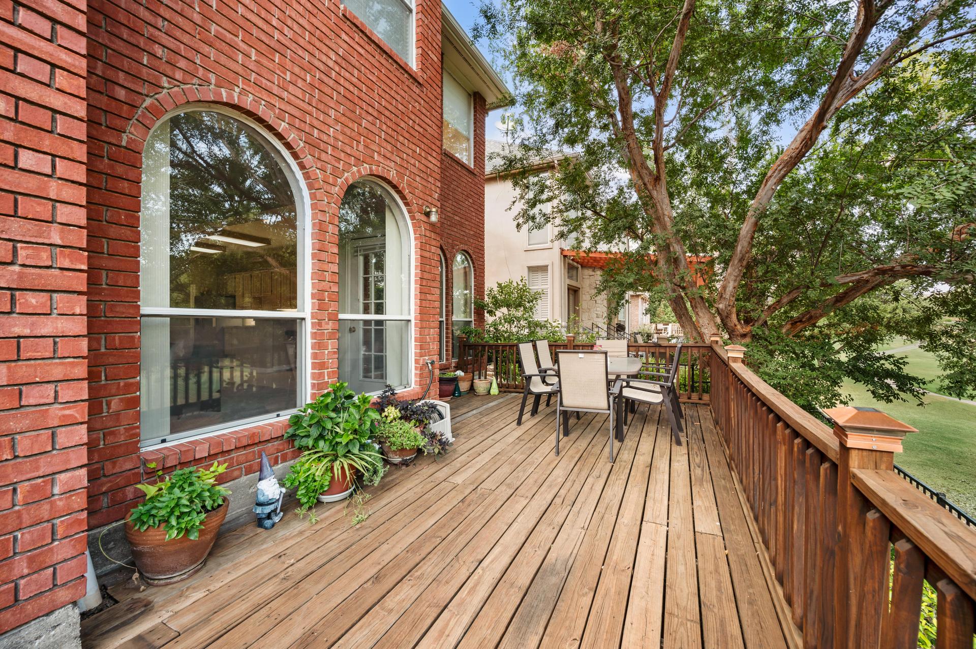 Brick patio and deck overlooking the golf course at 7626 Lakecrest Circle