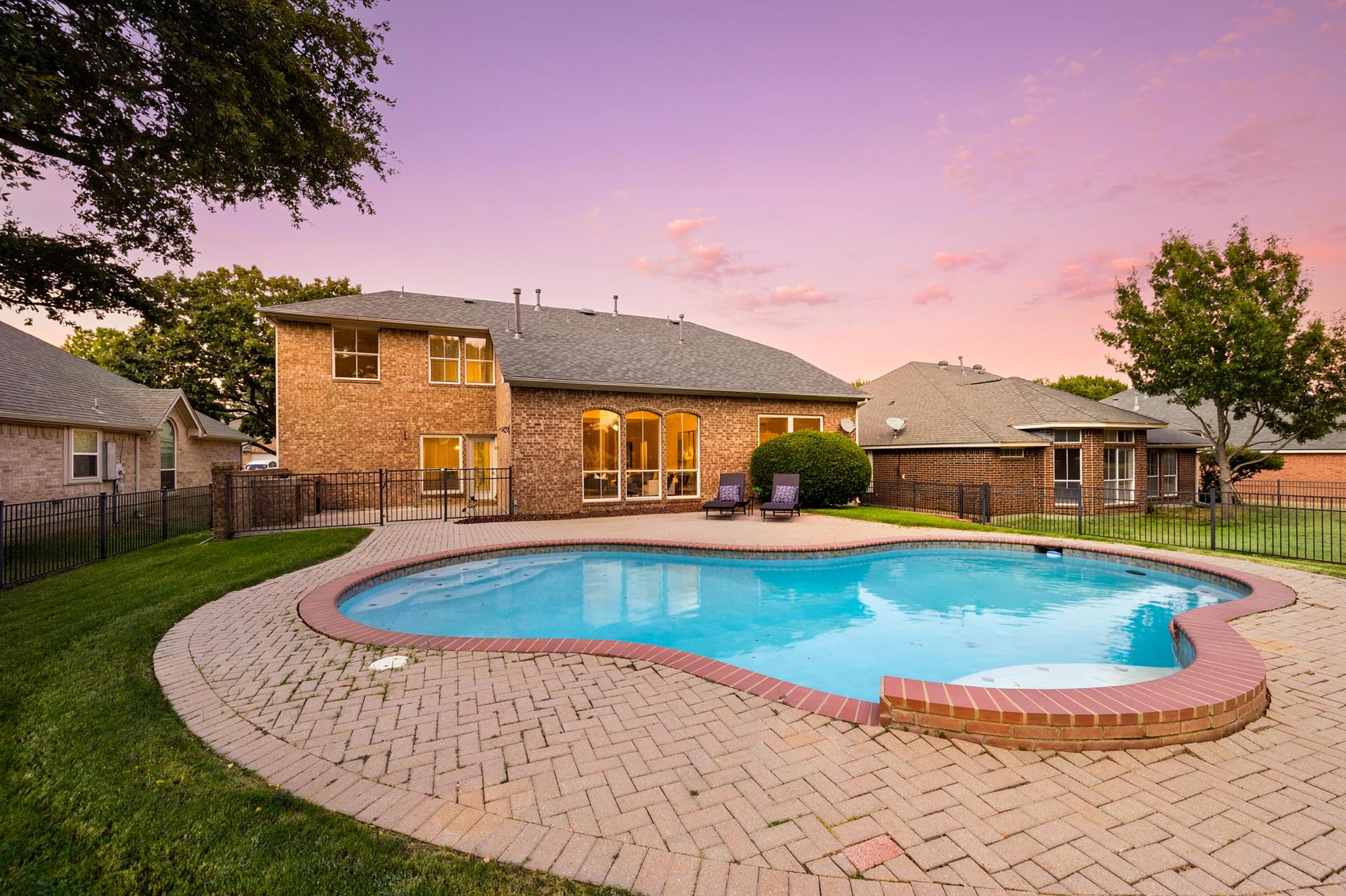 Backyard pool and outdoor living area at 3628 Stone Creek Lane S in North Fort Worth