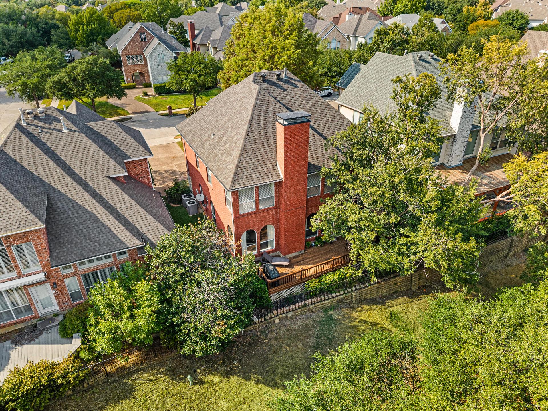Aerial view of 7626 Lakecrest Circle and surrounding Hackberry Creek neighborhood