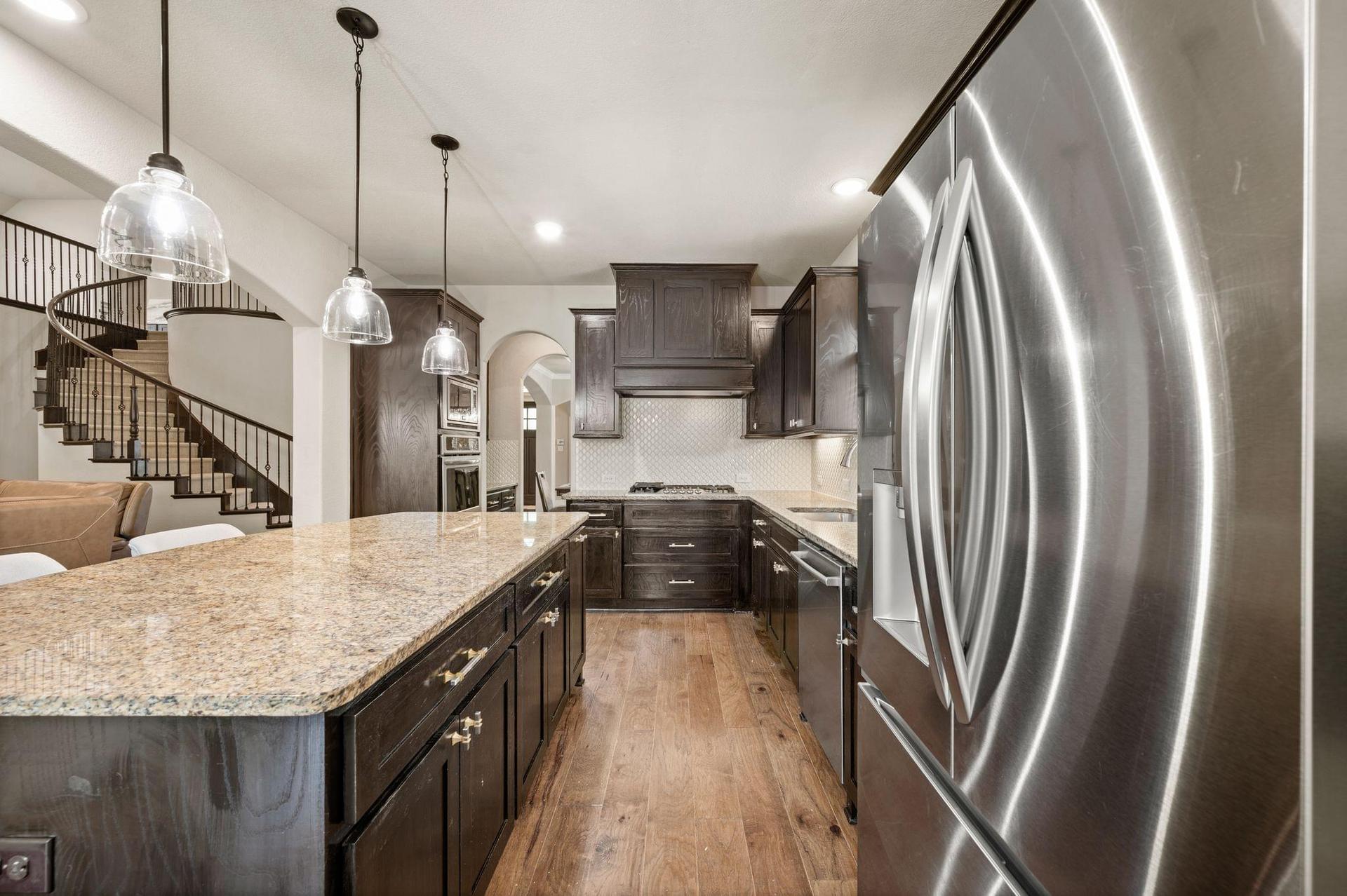 Kitchen with granite countertops and center island at 4201 Rainwater Creek Way