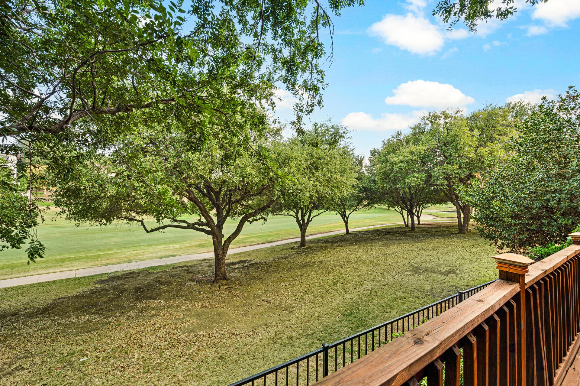 Wood deck with outdoor seating and golf course views at 7626 Lakecrest Circle