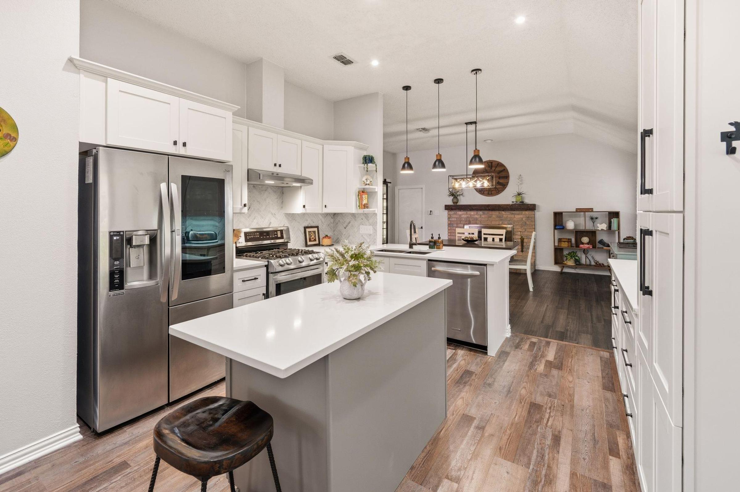 Beautifully updated kitchen with quartz countertops and oversized island